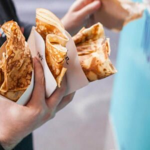 Person holding three crepes