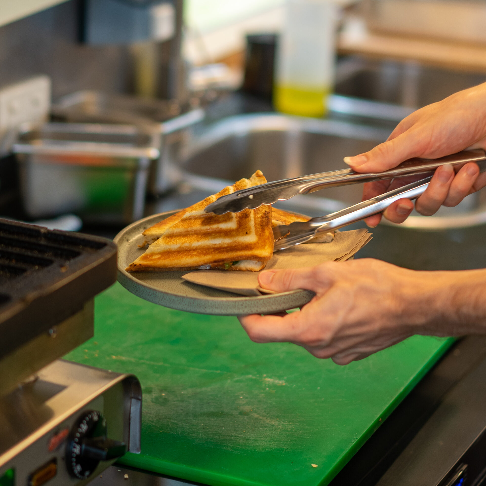 Toasted sandwich being served up on a plate